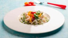 Tagliatelle di seppia con pomodorini rossi e gialli Tagliatelle di seppia con pomodorini rossi e gialli