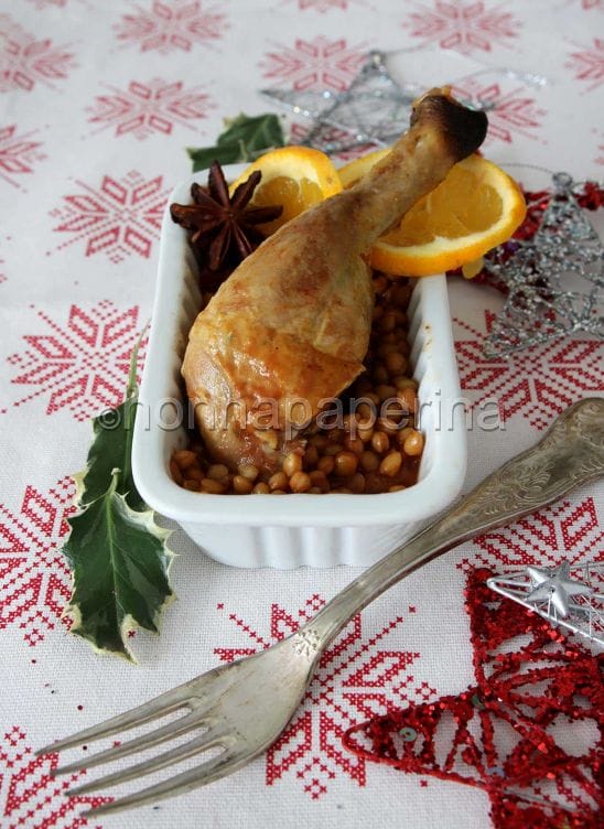 Cosce di faraona marinate all'arancia con lenticchie speziate