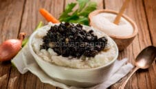 Polenta Bianca con seppie al nero: tradizione