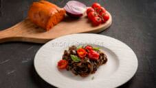 Tonnarelli al nero di seppia con pomodoro alla ‘nduja Tonnarelli al nero di seppia con pomodoro alla ‘nduja